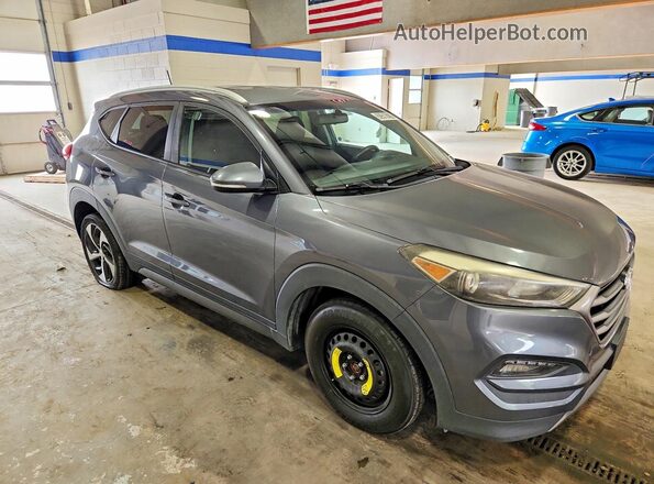 KM8J33A22GU183395 2016 HYUNDAI TUCSON Gray Front view