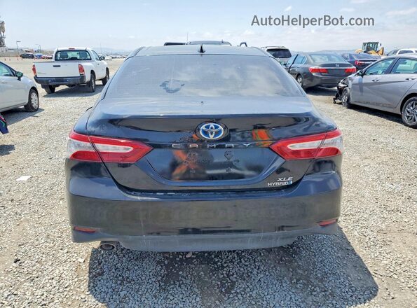 4T1B21HK7KU516393 2019 TOYOTA CAMRY Black Front interior view