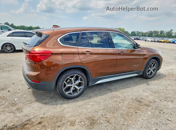 WBXHU7C3XH5H32940 2017 BMW X1 Brown Передня права чверть