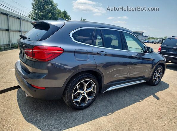 WBXHT3C30J5K25396 2018 BMW X1 Gray Front right