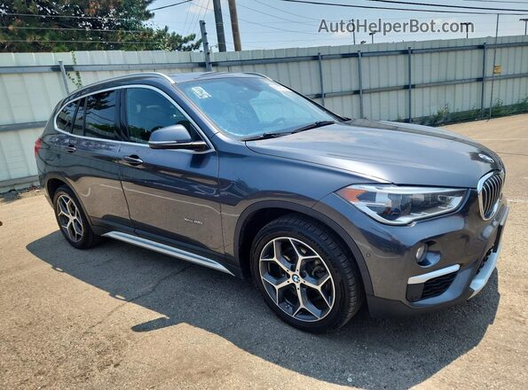 WBXHT3C30J5K25396 2018 BMW X1 Gray Front view