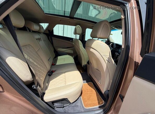 KM8J33A29GU142357 2016 HYUNDAI TUCSON Brown Widok wnętrza z przodu