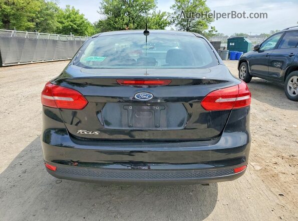1FADP3E22GL219758 2016 FORD FOCUS Черный Вид салона спереди