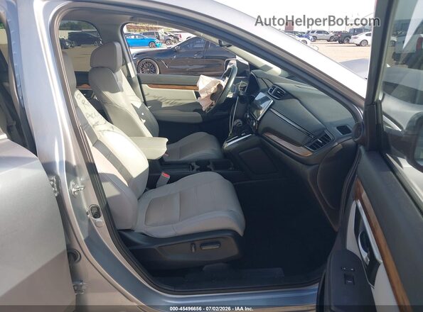 7FARW1H96KE009874 2019 HONDA CR-V Серебряный Вид салона спереди