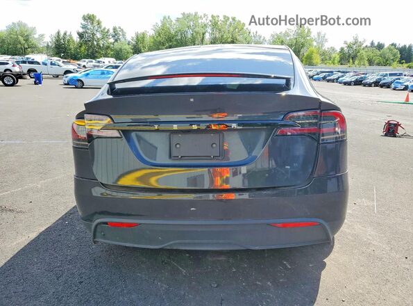 7SAXCDE58RF451986 2024 TESLA MODEL Black Rear view