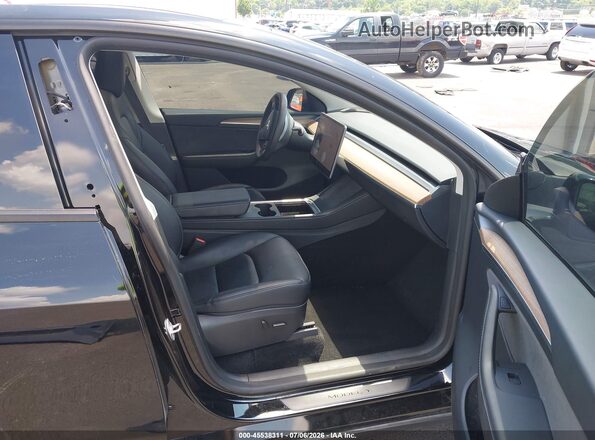 7SAYGAEE0SF269048 2025 TESLA MODEL Y Black Widok wnętrza z przodu