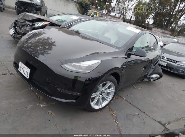 7SAYGAEE2PF646437 2023 TESLA MODEL Y Black Przód lewy