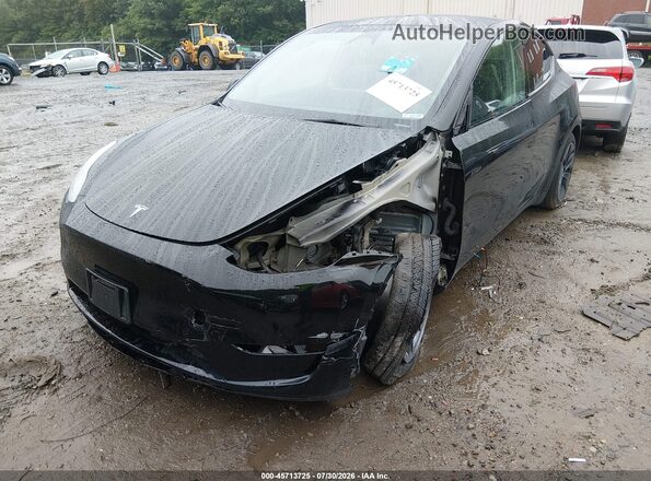 7SAYGAEE2RF151478 2024 TESLA MODEL Y Black Առջևի ձախ երեք քառորդ տեսարան