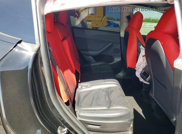 7SAYGAEE3RF991107 2024 TESLA MODEL Black Rear interior view
