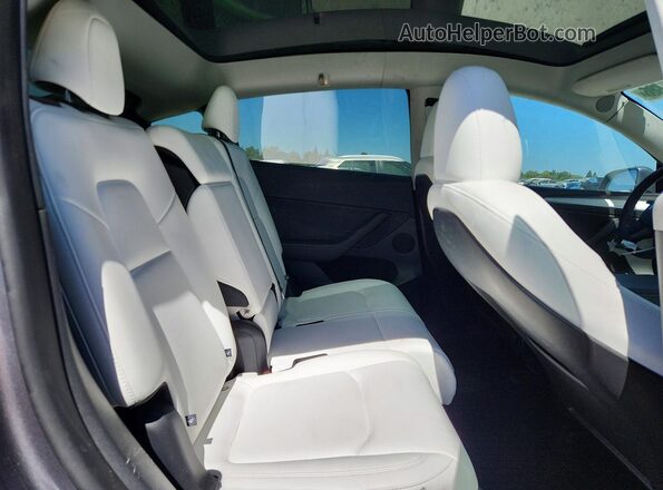 7SAYGAEE6SF219870 2025 TESLA MODEL Gray Vista de los asientos traseros