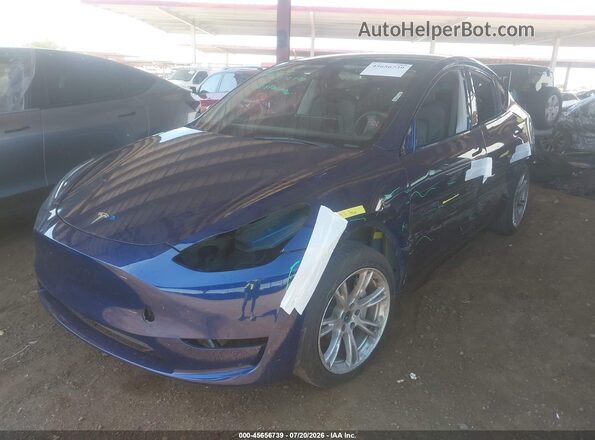 7SAYGAEE7PF897471 2023 TESLA MODEL Y Blue წინა მარცხენა ხედი სამი მეოთხედიდან