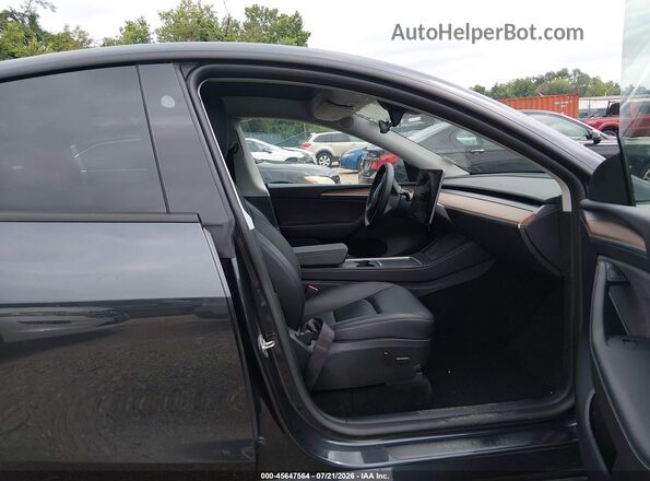 7SAYGDED3SF223481 2025 TESLA MODEL Y Gray Widok wnętrza z przodu