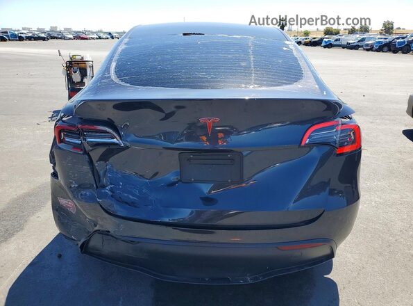 7SAYGDED6RF097322 2024 TESLA MODEL Charcoal Հետևի տեսք