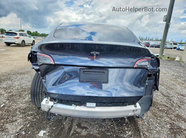 7SAYGDED7RA329696 2024 TESLA MODEL Gray Widok z tyłu