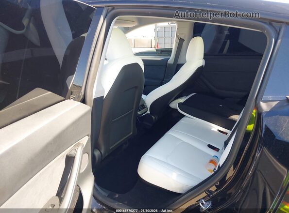 7SAYGDED7SF231017 2025 TESLA MODEL Y Black Widok naklejki z numerem VIN