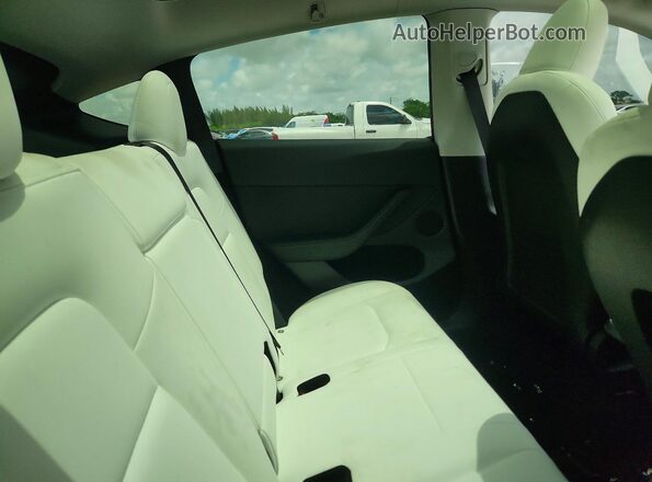 7SAYGDED8RF184090 2024 TESLA MODEL Blue Rear seats view