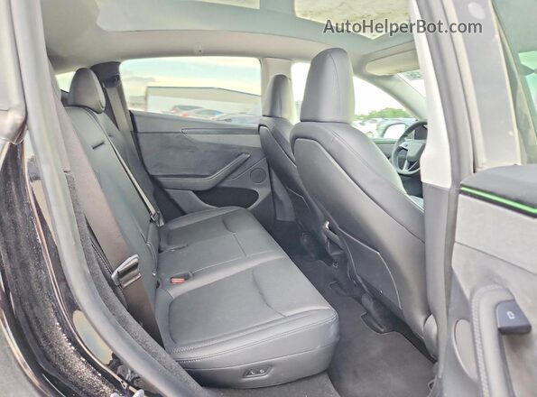 7SAYGDED8TA454679 2026 TESLA MODEL Black Rear interior view