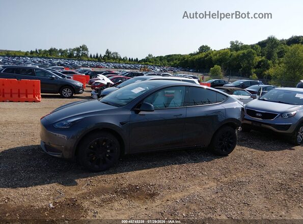 7SAYGDED9PF948106 2023 TESLA MODEL Y Gray Սալոնի հետևի տեսք