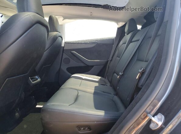 7SAYGDED9TA436885 2026 TESLA MODEL Charcoal Vista interior trasera