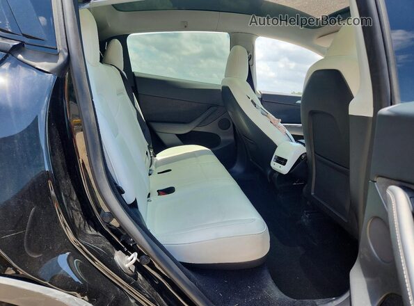 7SAYGDEDXRF103672 2024 TESLA MODEL Черный Вид задней части салона