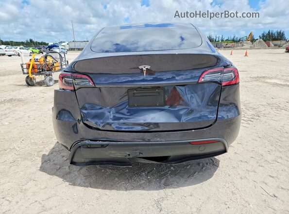 7SAYGDEDXRF190652 2024 TESLA MODEL Gray Rear view
