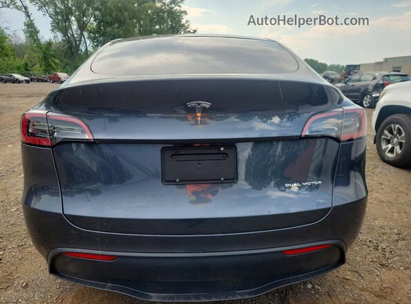 7SAYGDEE0PA040147 2023 TESLA MODEL Gray Vista trasera