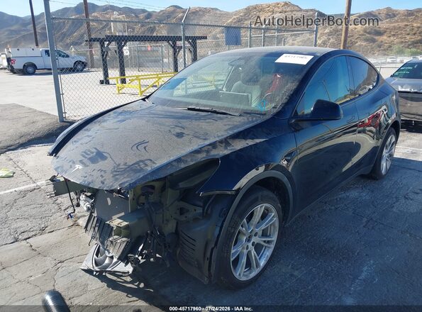7SAYGDEE1PF802596 2023 TESLA MODEL Y Black წინა მარცხენა ხედი სამი მეოთხედიდან