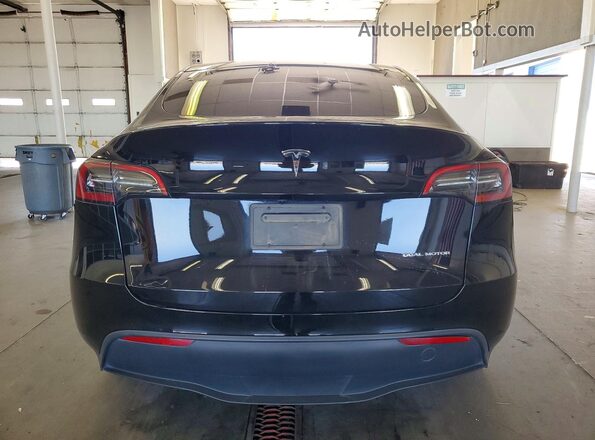 7SAYGDEE1RF990507 2024 TESLA MODEL Black Rear view