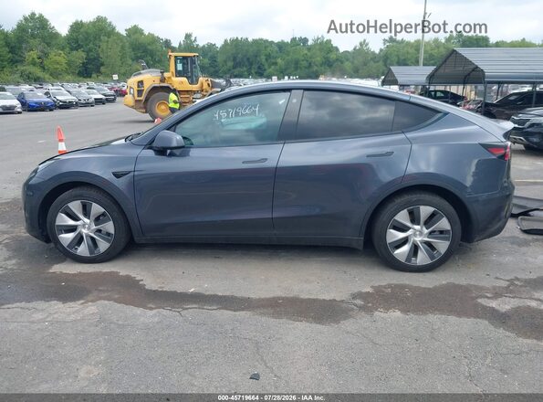 7SAYGDEE2PF594339 2023 TESLA MODEL Y Gray Widok wnętrza z tyłu