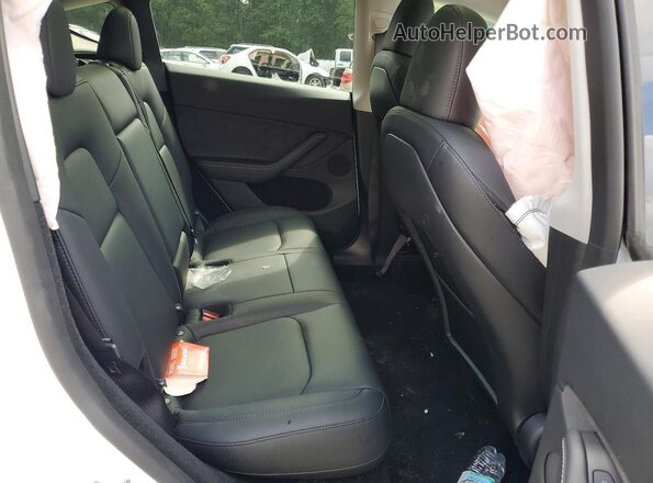 7SAYGDEE2RA328562 2024 TESLA MODEL White Rear interior view