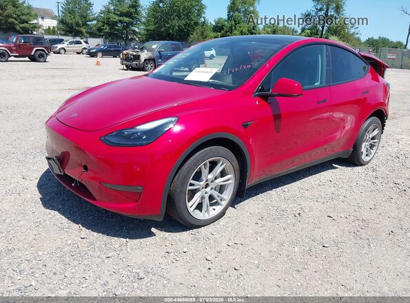 7SAYGDEE3PA043561 2023 TESLA MODEL Y Red Передня ліва чверть