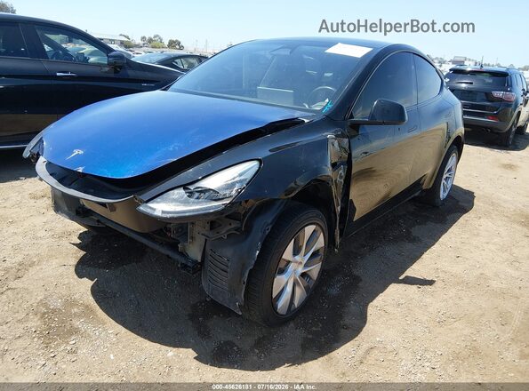 7SAYGDEE3PA152568 2023 TESLA MODEL Y Black Vista tres cuartos delantera izquierda
