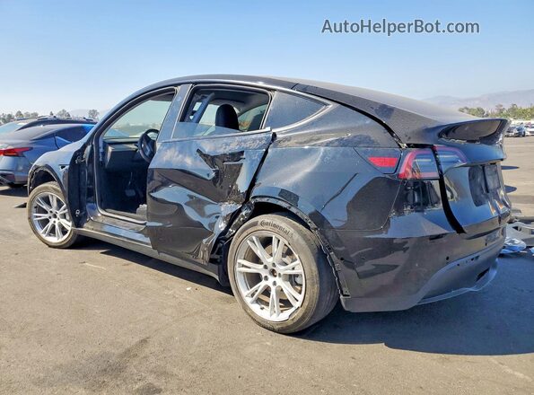 7SAYGDEE4PA156824 2023 TESLA MODEL Black Trasero izquierdo