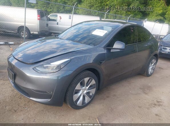 7SAYGDEE4PA205763 2023 TESLA MODEL Y Gray Vista tres cuartos delantera izquierda