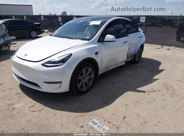 7SAYGDEE4RA291014 2024 TESLA MODEL Y White Vista tres cuartos delantera izquierda