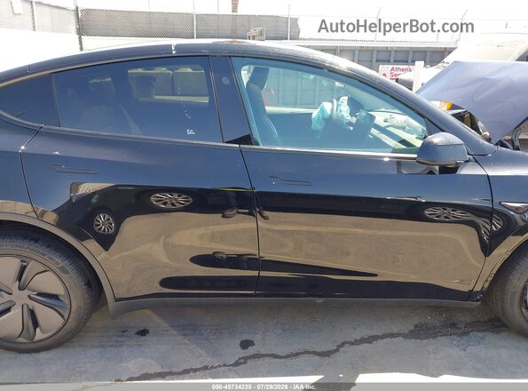 7SAYGDEE4TF543614 2026 TESLA MODEL Y Black Սալոնի հետևի տեսք