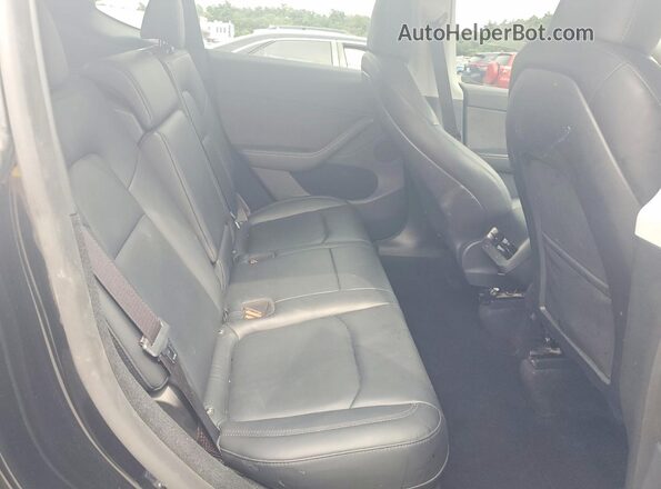 7SAYGDEE5RA306832 2024 TESLA MODEL Black Vista de los asientos traseros