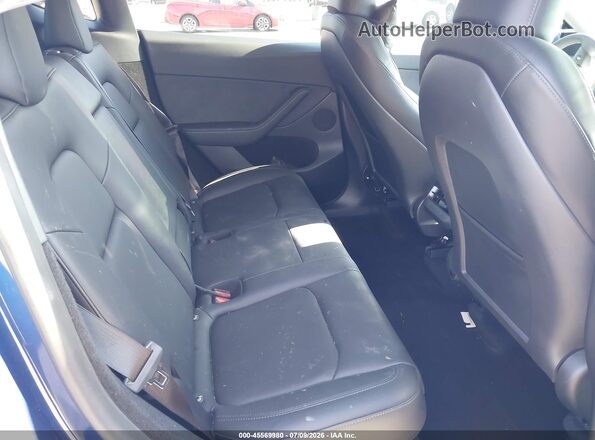 7SAYGDEE7RF007703 2024 TESLA MODEL Y Blue VIN კოდის სტიკერის ხედი