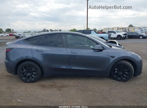 7SAYGDEE8PA200615 2023 TESLA MODEL Y Серый Вид задней части салона