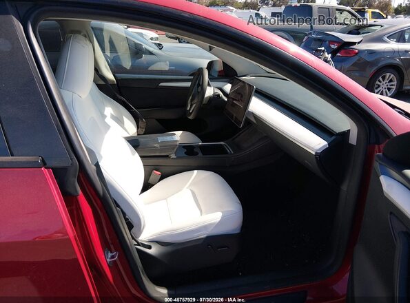7SAYGDEE8PF831951 2023 TESLA MODEL Y Red Вид салону спереду
