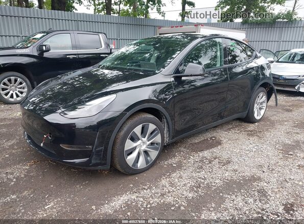 7SAYGDEE8PF978707 2023 TESLA MODEL Y Black Vista tres cuartos delantera izquierda