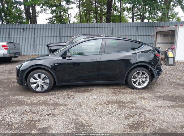 7SAYGDEE8PF978707 2023 TESLA MODEL Y Black Vista interior trasera