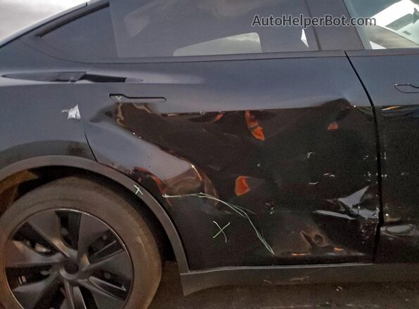 7SAYGDEE8SF299108 2025 TESLA MODEL Charcoal Vista de los asientos traseros