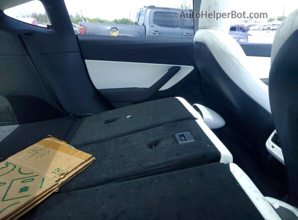 7SAYGDEE9NF436335 2022 TESLA MODEL Charcoal Vista de los asientos traseros