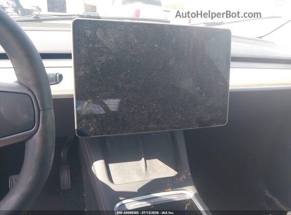 7SAYGDEE9RA304551 2024 TESLA MODEL Y Gray Widok tylnych siedzeń