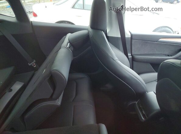7SAYGDEE9SA349981 2025 TESLA MODEL Blue Vista de los asientos traseros
