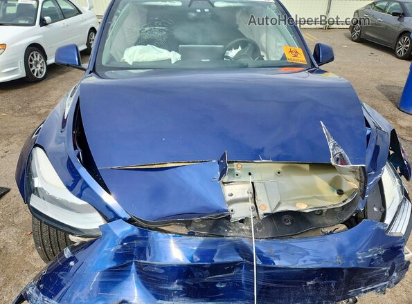 7SAYGDEEXNF430074 2022 TESLA MODEL Blue Rear interior view