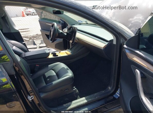 7SAYGDEF0PF668575 2023 TESLA MODEL Y Black Вид салону спереду
