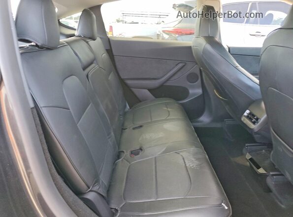 7SAYGDEF1RF079621 2024 TESLA MODEL Charcoal Rear interior view