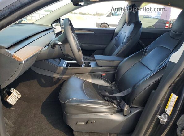 7SAYGDEF1RF079621 2024 TESLA MODEL Charcoal Front interior view